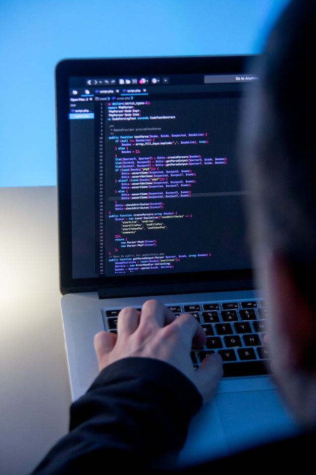 Premium Photo | Programmer working on laptop computer in office studio