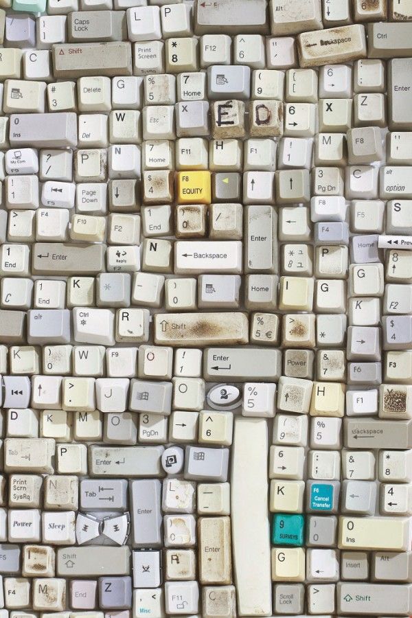 Room tiled with worn keyboard keys